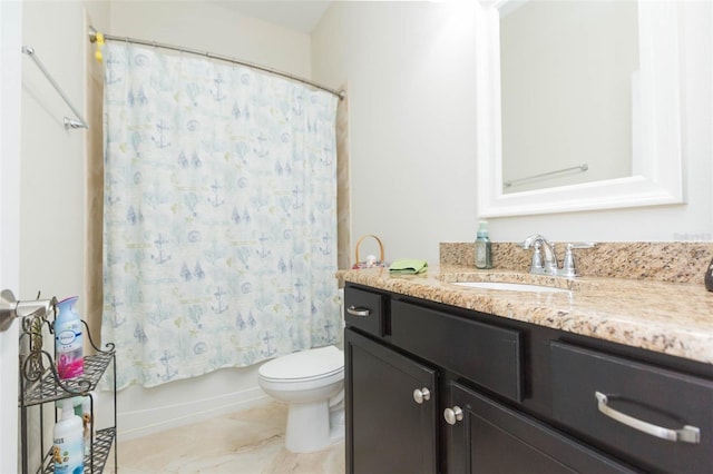 bathroom with toilet, shower / bath combo, and vanity