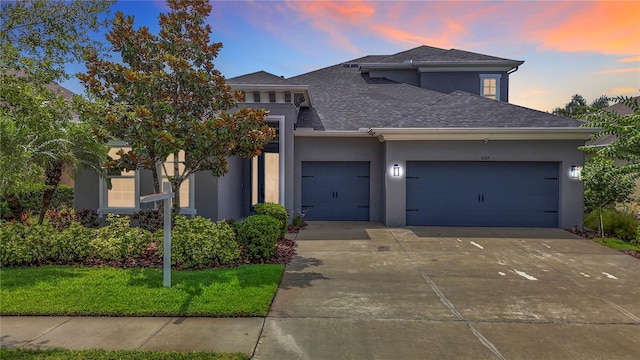 6527 Mayport Dr, Apollo Beach, FL 33572 - prairie-style house with a garage, stucco siding, driveway, and roof with shingles
