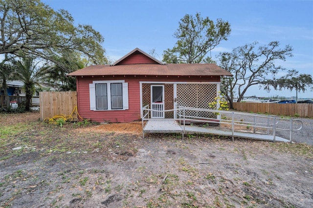 view of front of house featuring fence