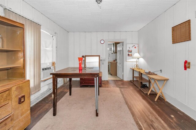 home office with cooling unit and wood finished floors