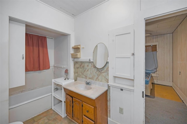 full bathroom with a washtub and vanity