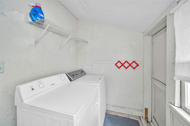 washroom featuring independent washer and dryer and laundry area