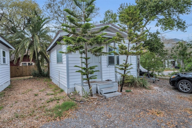 view of property exterior featuring fence