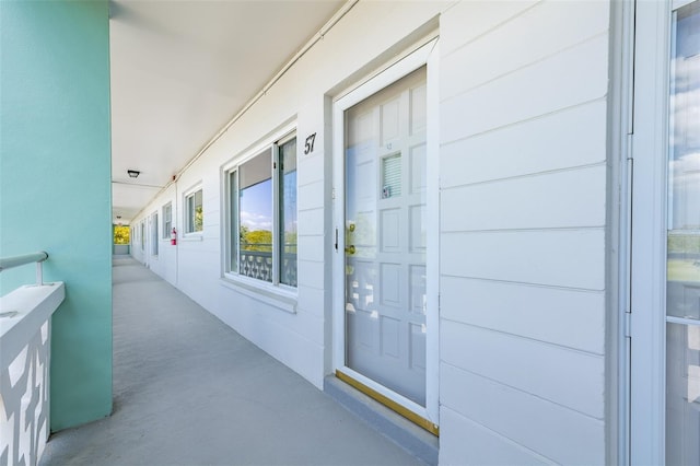 doorway to property featuring covered porch