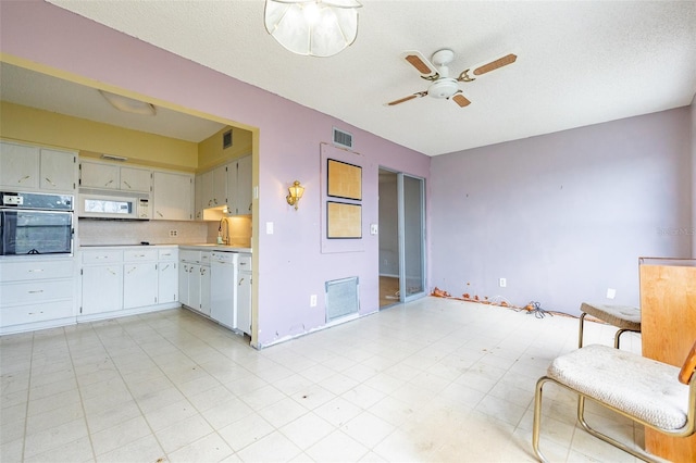 kitchen featuring white appliances, light countertops, visible vents, and ceiling fan