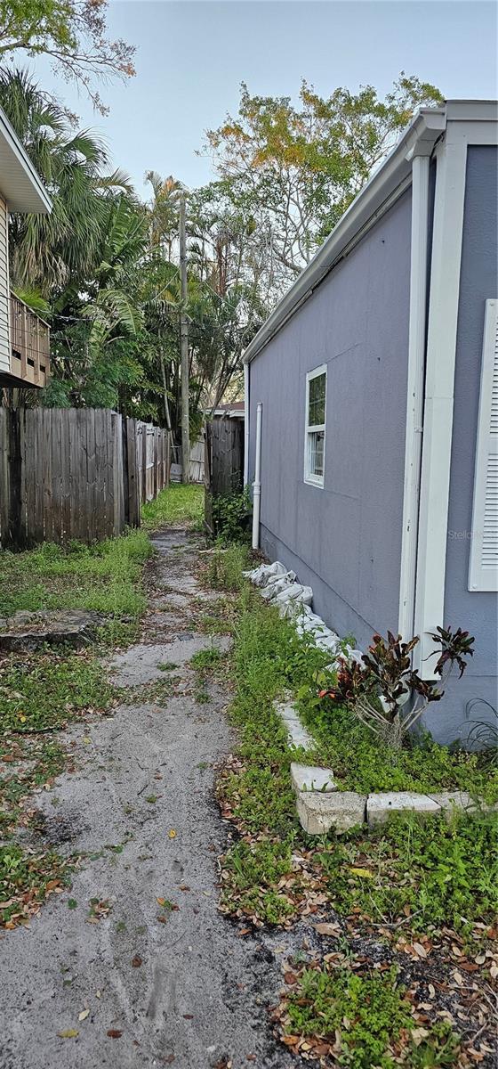 view of side of property featuring fence