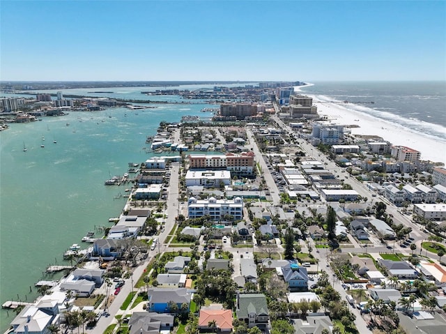 drone / aerial view featuring a view of city and a water view