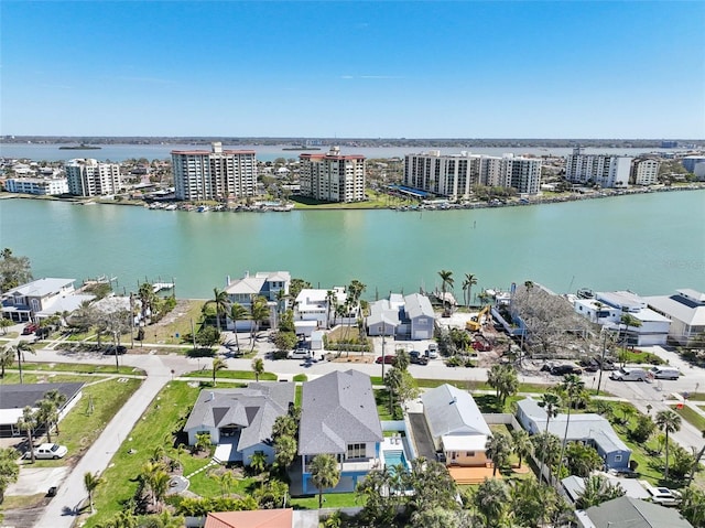 birds eye view of property featuring a view of city and a water view