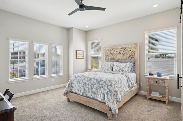 carpeted bedroom featuring recessed lighting, baseboards, and ceiling fan