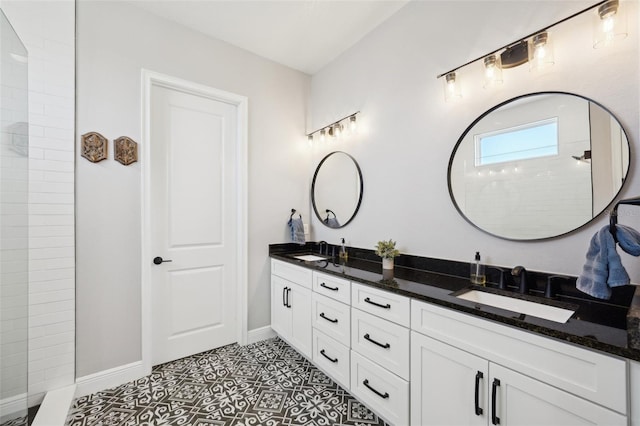 full bathroom featuring double vanity, a walk in shower, and a sink