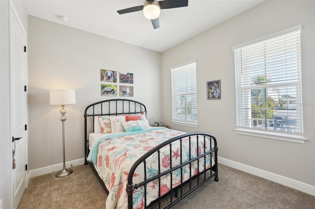 bedroom featuring baseboards, carpet, and a ceiling fan