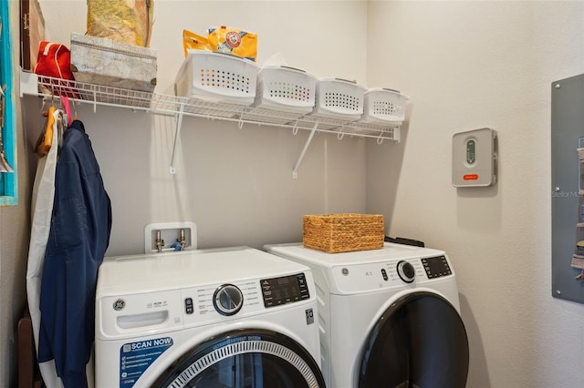 washroom featuring washer and dryer and laundry area