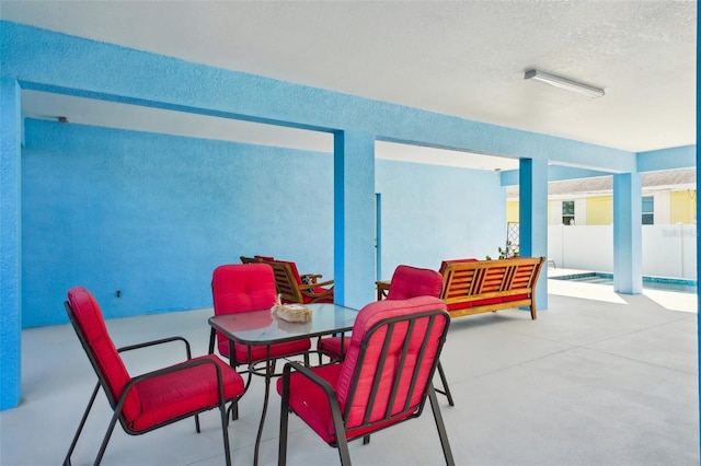 view of patio / terrace featuring outdoor dining space and fence