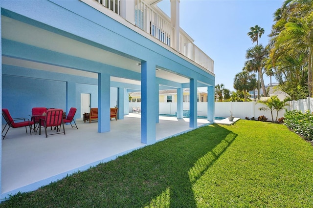 view of yard featuring a patio area and fence