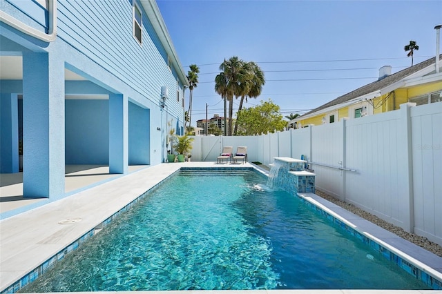 view of pool featuring a patio area, a fenced in pool, and a fenced backyard