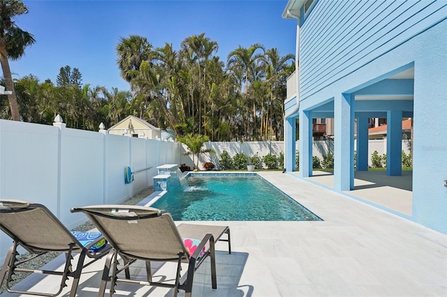 view of pool featuring a fenced in pool, a fenced backyard, and a patio area