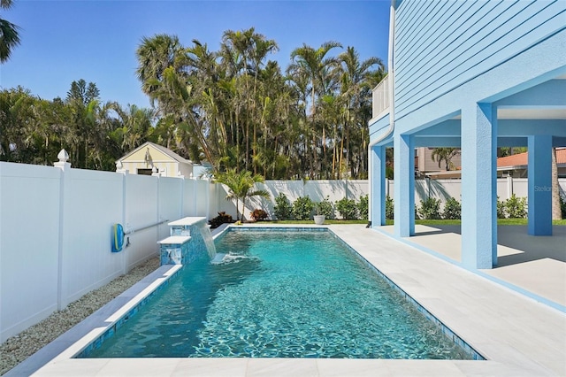 view of pool with a fenced in pool, a fenced backyard, and a patio area