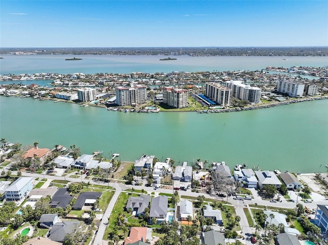 birds eye view of property featuring a water view and a view of city