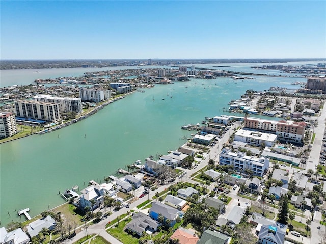 drone / aerial view featuring a city view and a water view