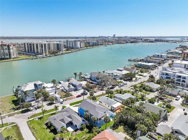 birds eye view of property with a view of city and a water view