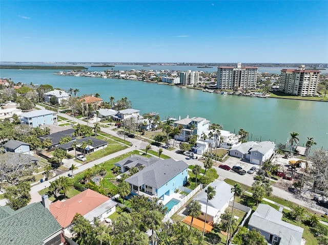 drone / aerial view featuring a city view and a water view