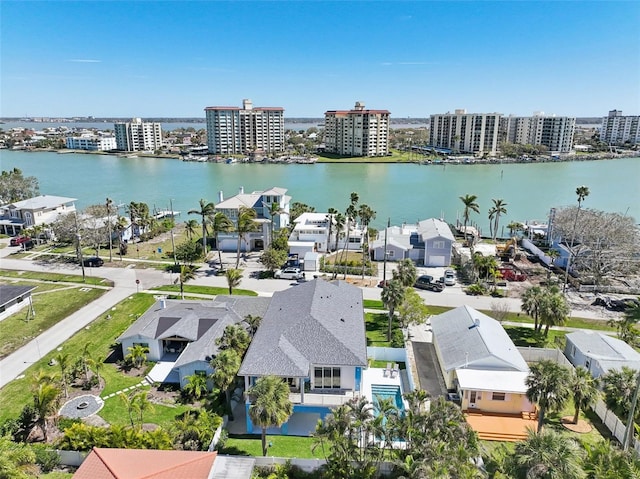 bird's eye view featuring a water view and a city view