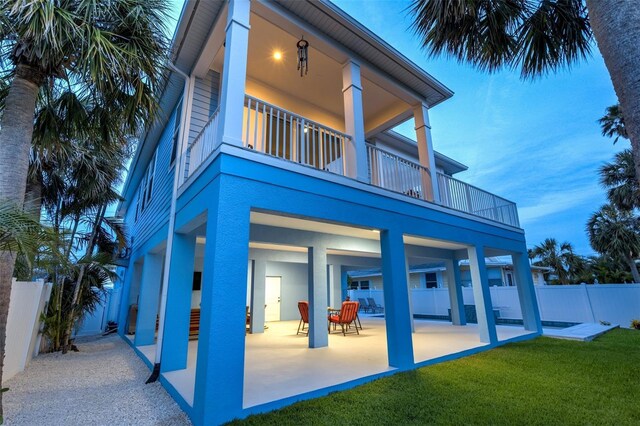720 Bay Esplanade, Clearwater Beach, FL 33767 - back of house featuring a balcony, a patio, and stucco siding