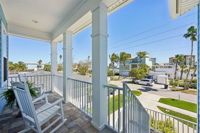 720 Bay Esplanade, Clearwater Beach, FL 33767 - balcony featuring covered porch