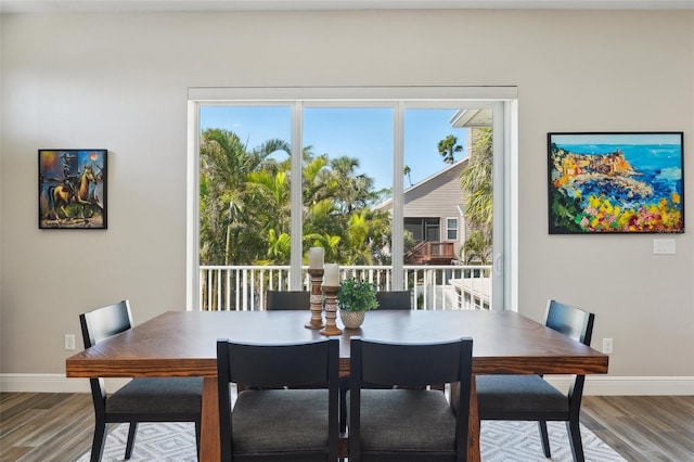 720 Bay Esplanade, Clearwater Beach, FL 33767 - dining space with wood finished floors and baseboards