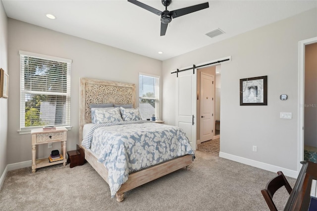 720 Bay Esplanade, Clearwater Beach, FL 33767 - carpeted bedroom with a barn door, baseboards, and ceiling fan
