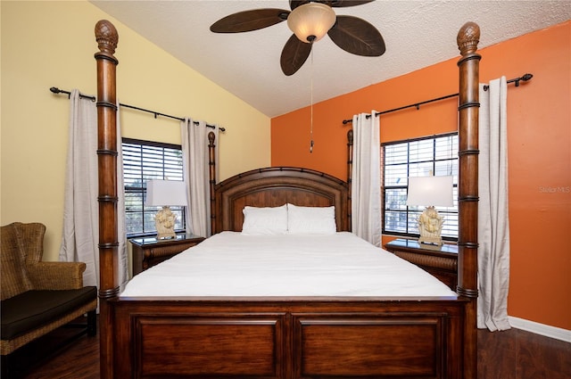 bedroom with dark wood-style floors, a textured ceiling, a ceiling fan, and vaulted ceiling