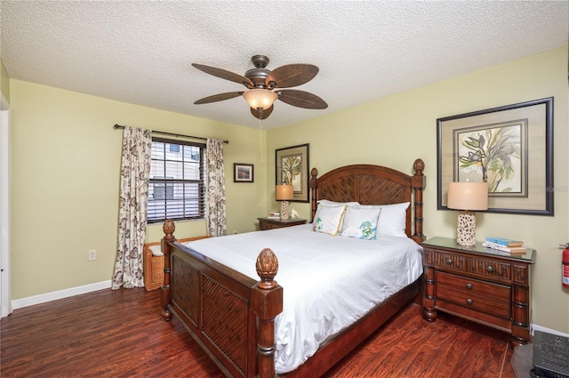 bedroom with a ceiling fan, wood finished floors, baseboards, and a textured ceiling