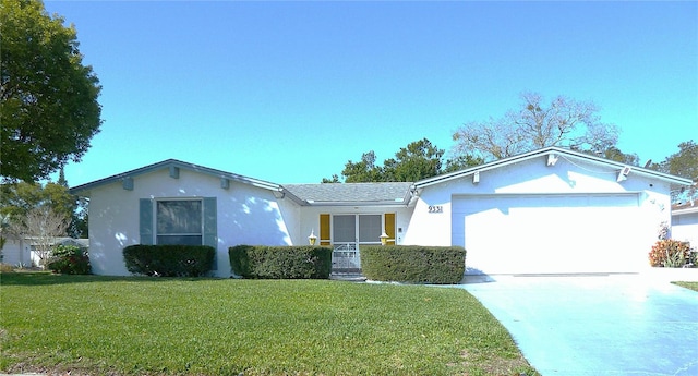 ranch-style house featuring a front yard, concrete driveway, a garage, and stucco siding