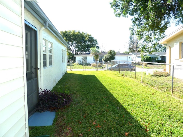 view of yard with fence and a residential view