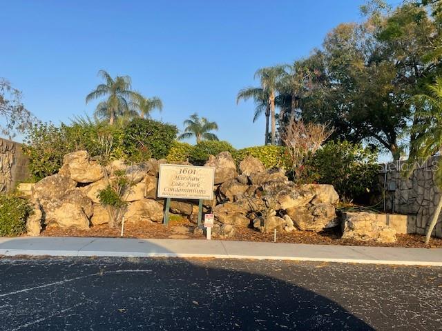 community sign with uncovered parking