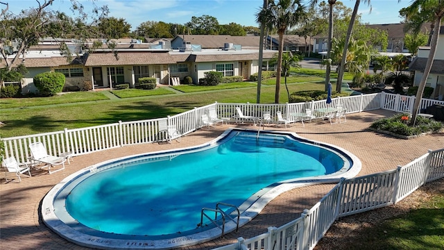 1601 43rd St N Unit 226, Saint Petersburg, FL 33713 - community pool featuring a residential view, a patio area, fence, and a lawn