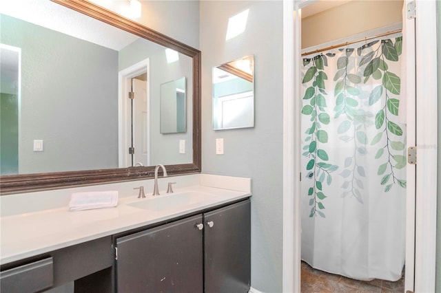 bathroom with vanity and a shower with curtain