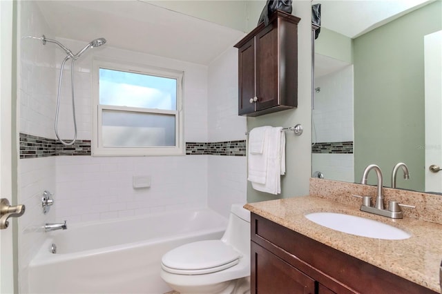 bathroom with bathtub / shower combination, toilet, and vanity