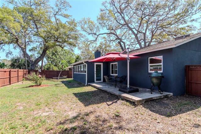 view of yard with a patio and a fenced backyard