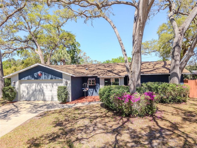 view of front of house with an attached garage and concrete driveway