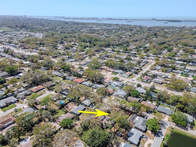 birds eye view of property featuring a residential view and a water view