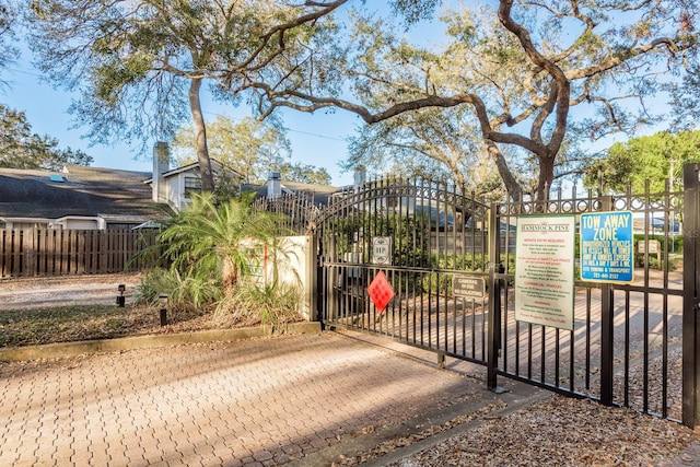 view of gate featuring fence