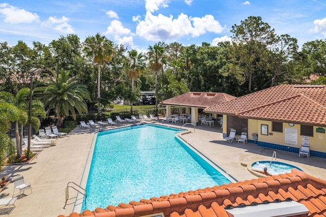 pool featuring a patio and fence