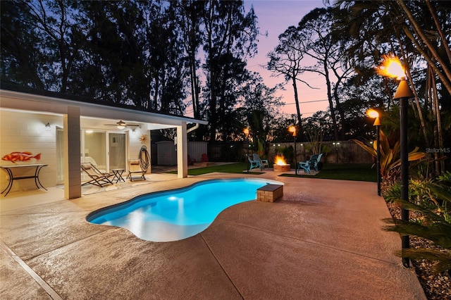 view of swimming pool with a patio, an outbuilding, a fenced in pool, and a fenced backyard