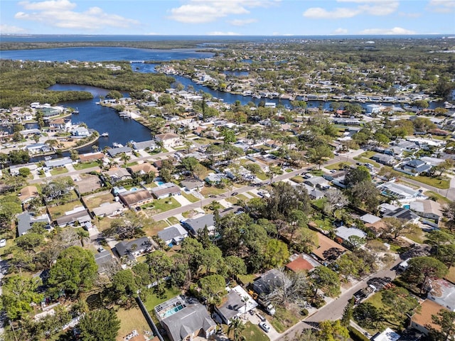 birds eye view of property with a residential view and a water view