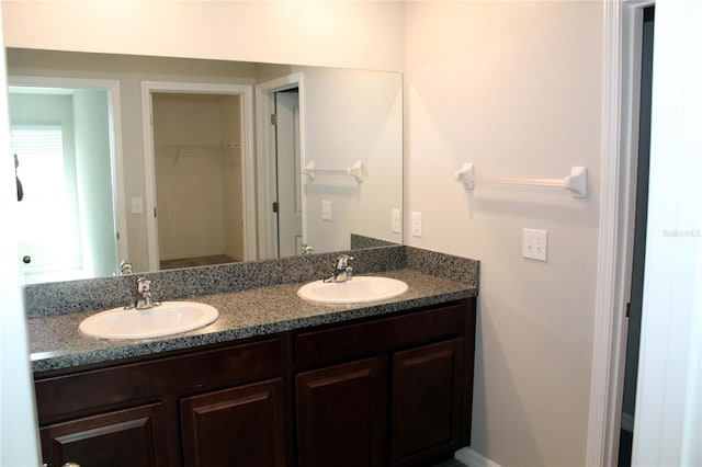 bathroom featuring double vanity and a sink