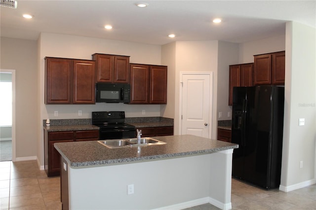 kitchen with visible vents, a kitchen island with sink, black appliances, a sink, and recessed lighting