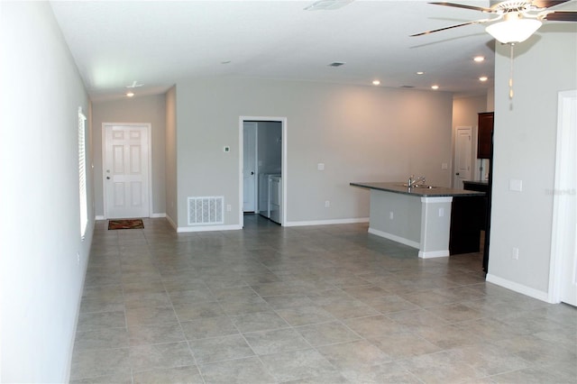 unfurnished living room featuring lofted ceiling, recessed lighting, a ceiling fan, visible vents, and baseboards