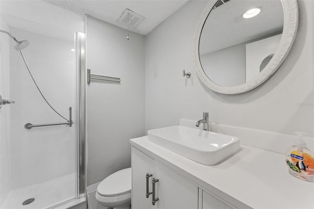 full bath featuring visible vents, a stall shower, toilet, and vanity