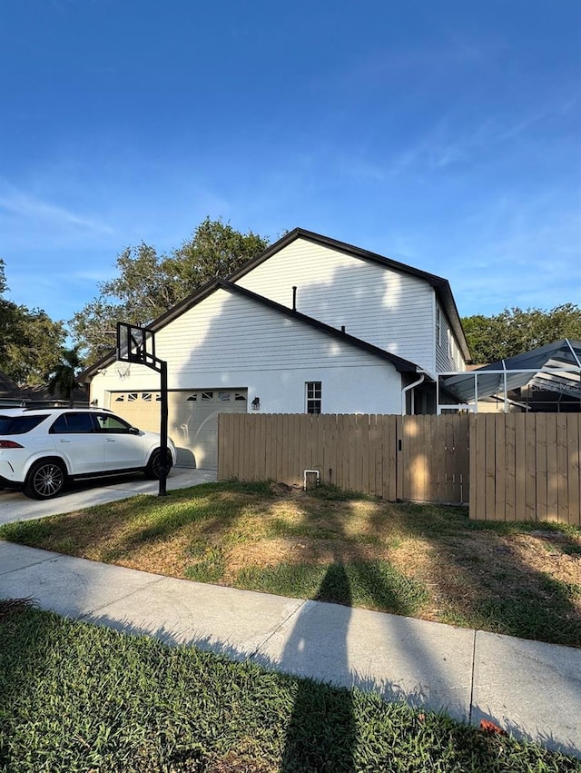 9067 Cypress Trl, Seminole, FL 33777 - view of side of property with a garage